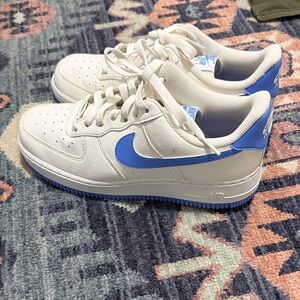 Nike White Low-Top Sneakers with Blue Swoosh
